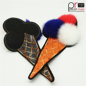 Håndsyet reversibel pom pom-is-lapp i høj kvalitet